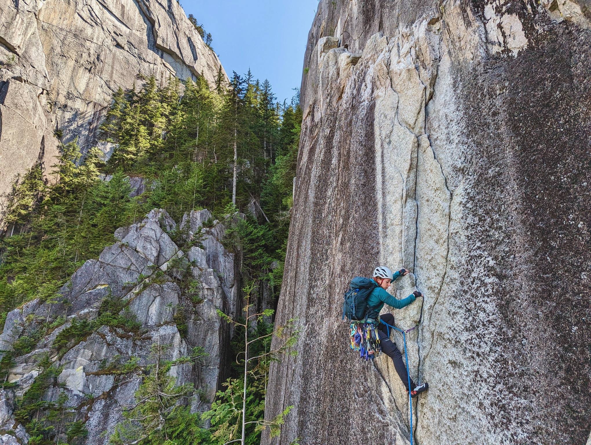 A photo of a woman rock climbing.